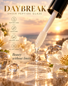 Daybreak clear Peptide Lip Glaze applicator editorial with glossy black cap, peptide care, squalane, organic oils, all-day shine, and Beauty Without Limits messaging.