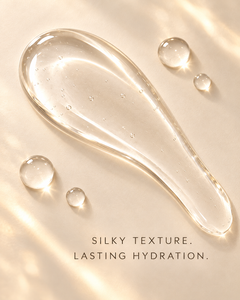 Daybreak clear Peptide Lip Glaze silky texture swatch with soft glossy droplets and lasting hydration messaging.