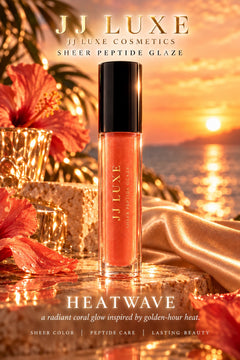 JJ Luxe Cosmetics Heatwave sheer coral peptide lip glaze in a golden seaside sunset scene with hibiscus flowers, champagne satin, crystal accents and softly glowing campaign lettering.