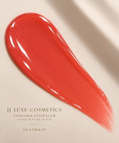 JJ Luxe Cosmetics Heatwave Sheer Peptide Glaze texture swatch in a sheer glossy coral finish