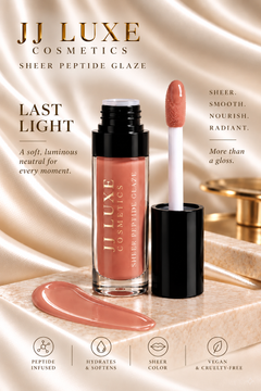 JJ Luxe Cosmetics Last Light Sheer Peptide Glaze formula benefits with open tube, doe-foot applicator and glossy warm nude swatch fully contained on ivory stone, styled with champagne satin.