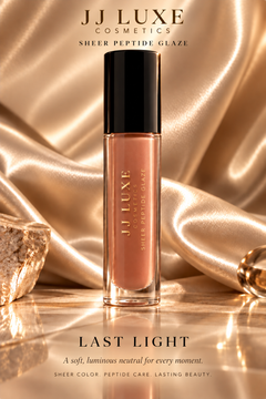 JJ Luxe Cosmetics Last Light Sheer Peptide Glaze in warm nude on champagne satin